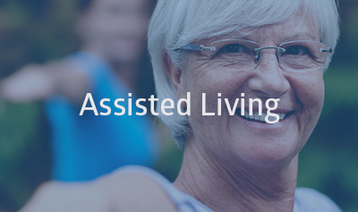 A smiling woman with the words Assisted living over her image