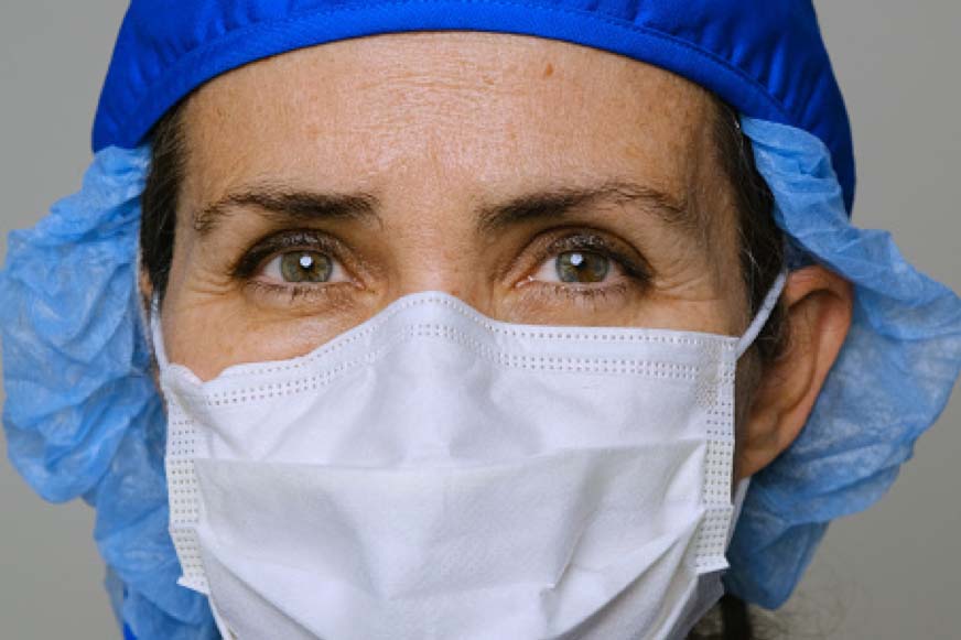 Clinician wearing PPE mask