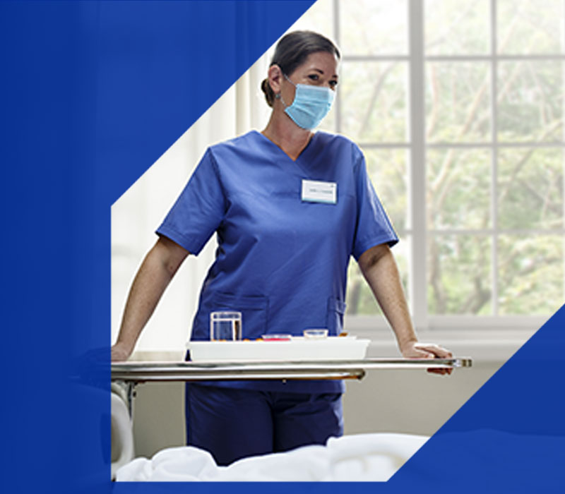 STK_A-nurse-serving-food-to-a-patient-mobile