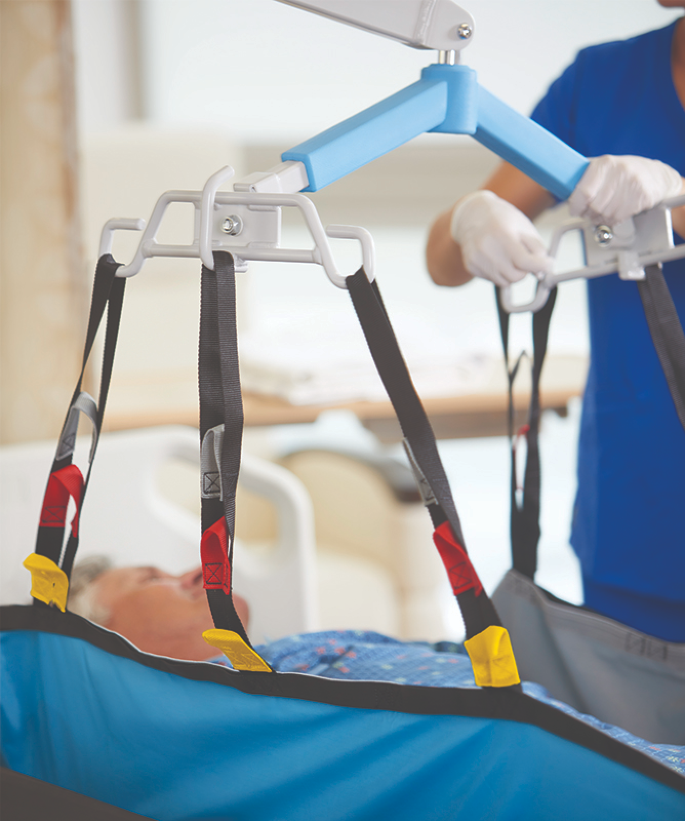 A patient mobility device with straps and a sling