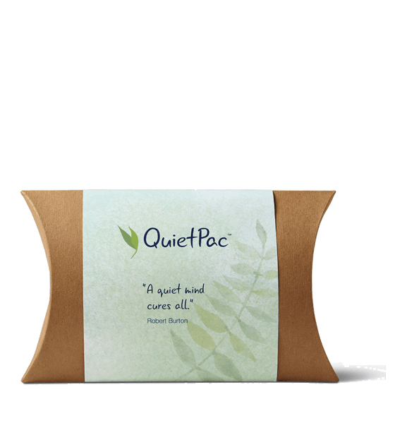 Photo of a rectangular cardboard pack with a green wrap sleeve reading QuietPac