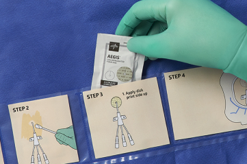 SKU_EBSI1254_With Hand_016_RGB_02 1 Closeup of gloved hand picking up a packaged alcohol swab from pocket in a dressing change system for a central line