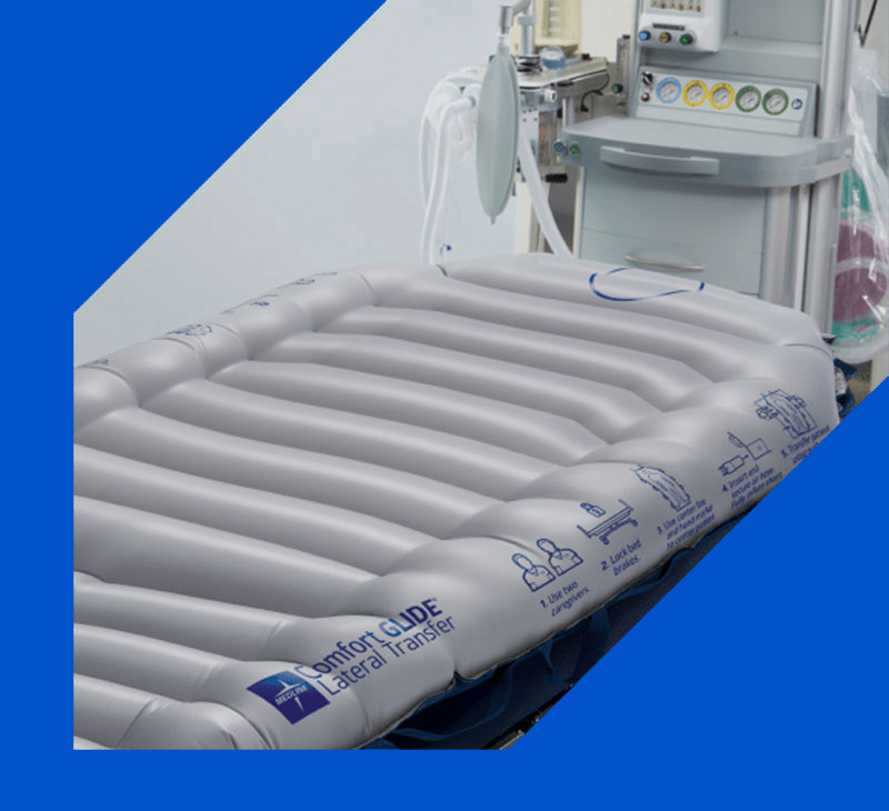 Close up of ComfortGlide Lateral Transfer Sheet in a room with other medical equipment