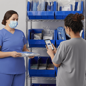 Two hospital employees taking inventory.