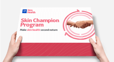Hands holding Medline Skin Champion Program box