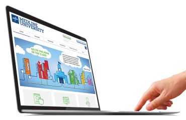 Hand touching they keyboard of a laptop computer displaying the Medline University website on the screen