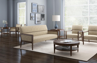A living room with a sofa and two chairs