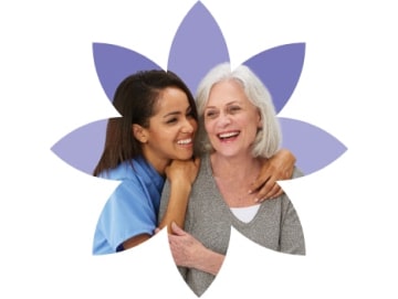 reduce-variation-3-min Younger woman hugging an older woman cropped in a stylized purple flower