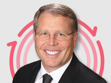 Randall-Wolcott Headshot of Dr. Randall Wolcott with three pink concentric circles in the background