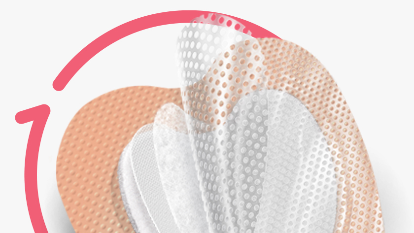 Sacral foam dressing for pressure ulcer prevention expanded to show all five layers.