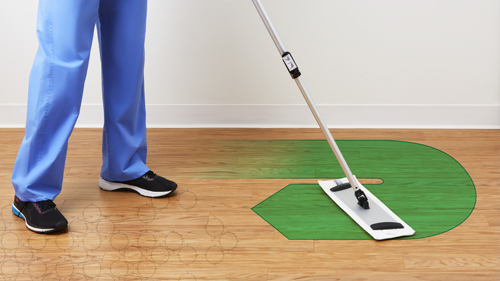 EVS worker dry mopping floor