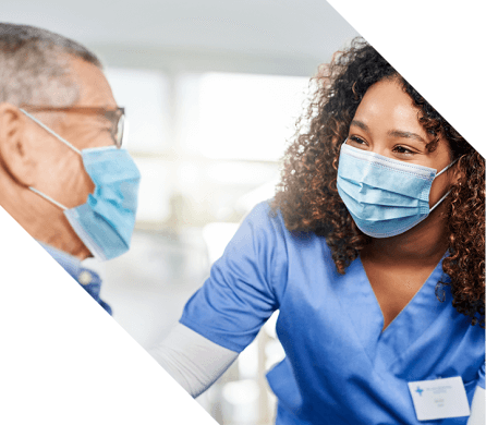Web-banner_Oregon-Veterans-Case-Study nurse in a mask talking to a patient in a mask