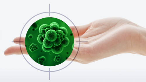 Hand with target on microorganisms in green