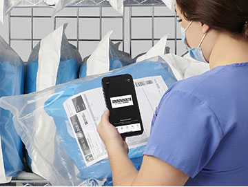 image of person scanning inventory with their phone