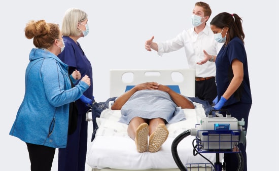 comfort-glide-system-1-min Medline Skin Health Representative gives a patient repositioning system demo to three caregivers