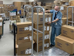 customized-sol-3-min person getting boxes off of a dolly