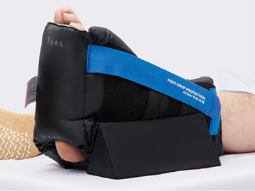 Patient wearingHeelMedix Advanced Heel Protector with anti rotation wedge to provide pressure redistribution