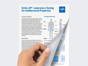 Hand lifting page of white paper on Remedy DriGo-HP displayed against a gray background