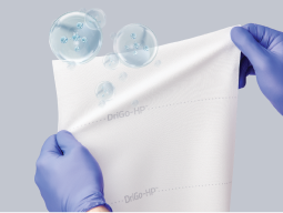 stay-fresh-formula Caregiver’s gloved hands stretch out Remedy DriGo-HP to reveal encapsulated hydrogen peroxide particles inside cloth