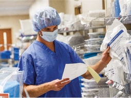 stay-info-2-min photo of a caregiver finding supplies on a shelf