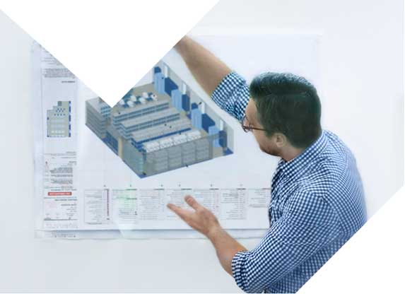 team member showing a CAD drawing of a warehouse space