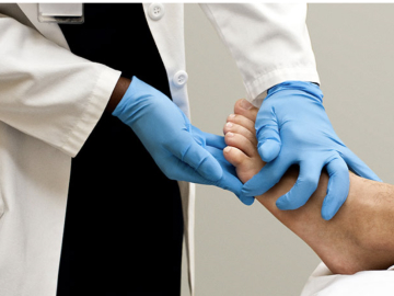 Clinician caring for patient’s foot