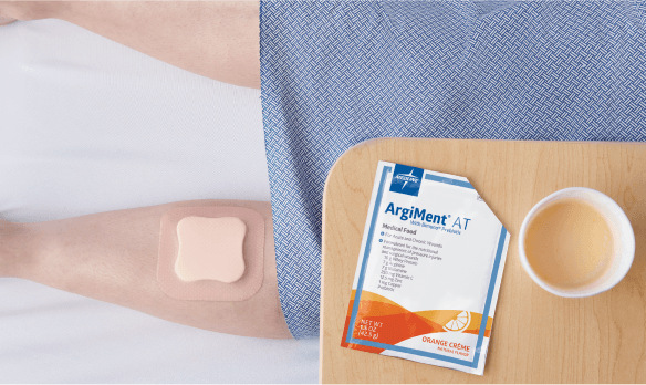 Patient with wound sits next to bedside table with medical nutrition product to promote healing