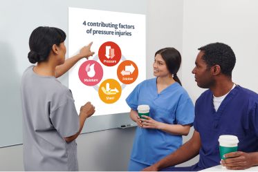 Female clinician standing by flip chart in front of people listening