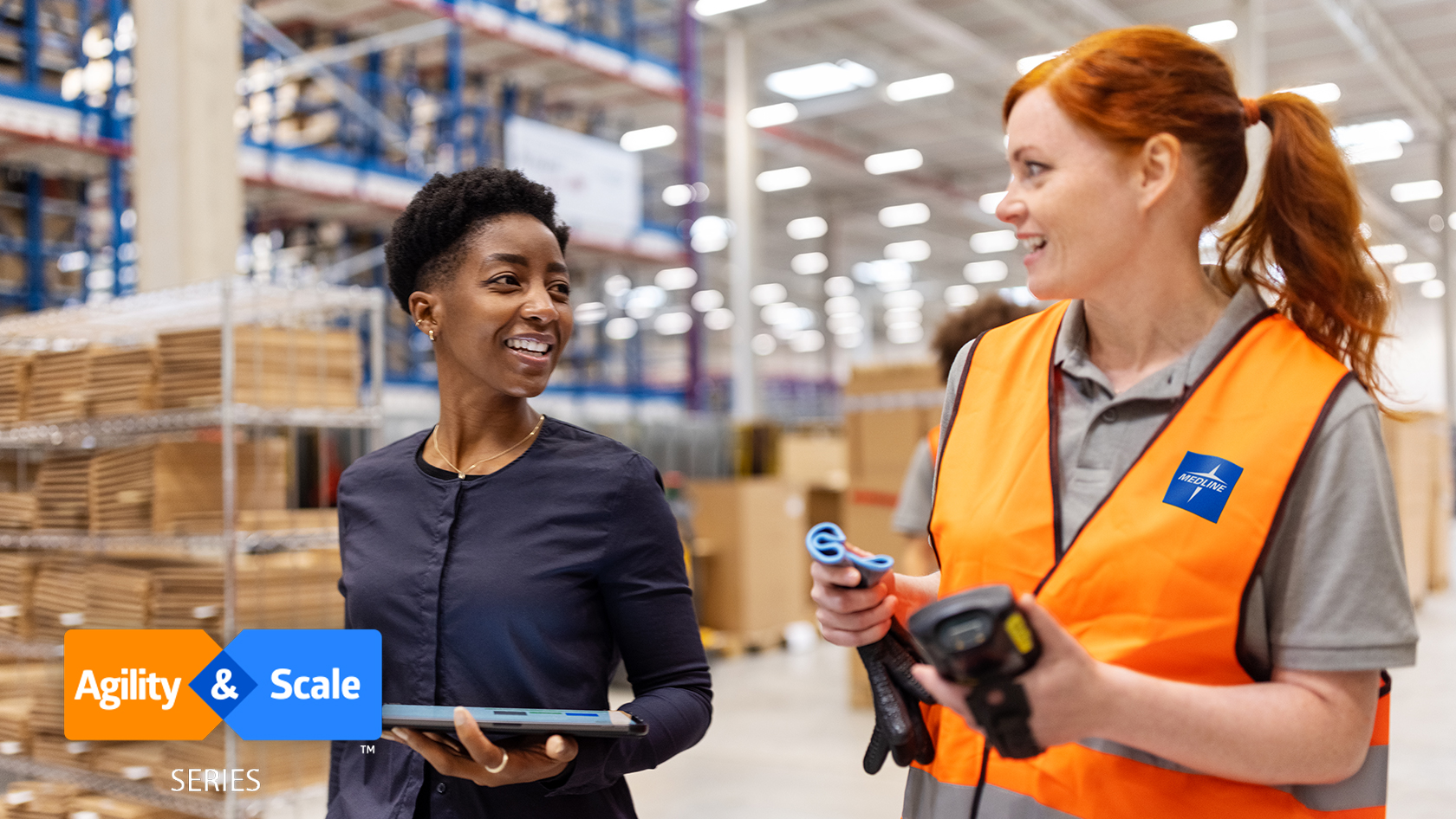 supply chain manager and warehouse worker discuss inventory in the warehouse