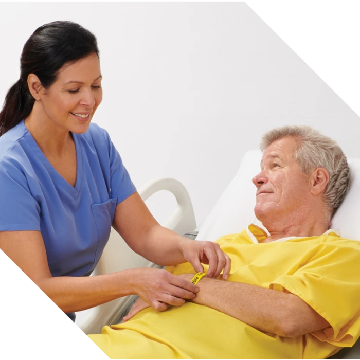 Clinician’s gloved hand applies Marathon XL to patient’s skin with wide applicator