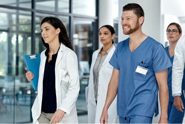 Female clinician carefully checks test tube in lab
