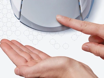 Hands using a sanitizer dispenser