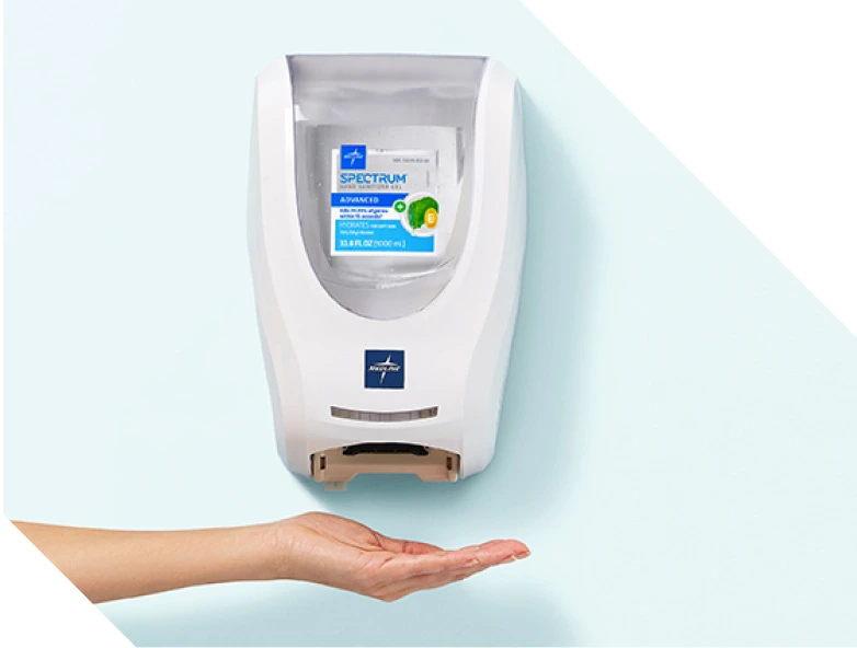 Wall mounted touchless Spectrum dispenser with hand under it to activate sensor;.