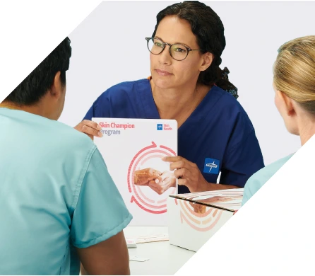 wound-care training-for nurses-and-clinicians Medline representative presents Skin Champion Program training materials to healthcare professionals