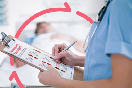 Caregiver views poster on staging pressure injuries at the foot of patient’s bed