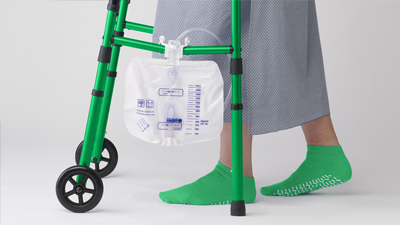 Urine bag hanging on walker of patient/resident