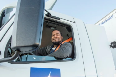 Medline driver sitting in the cab of a MedTrans truck