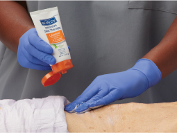 strong-barrier Clinician applying Remedy Calazime to individual