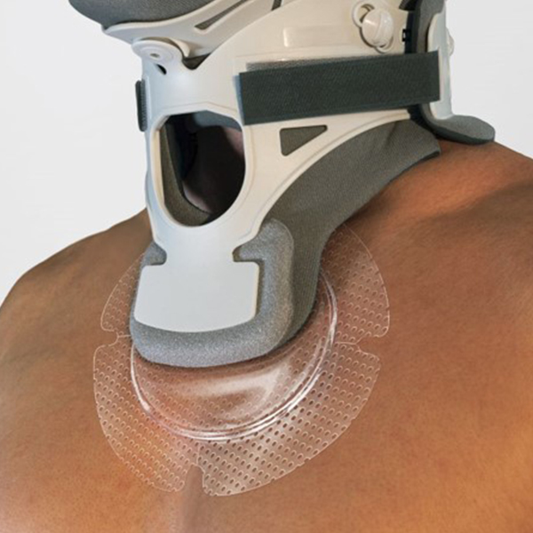 STK_Optiview_Round_in-us_neckbrace_FPO_RGB Patient wearing a neck brace has OptiView placed on his chest to protect the underlying skin from the device
