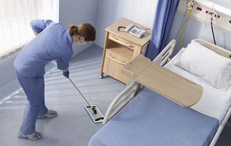 EVS staff mopping patient room