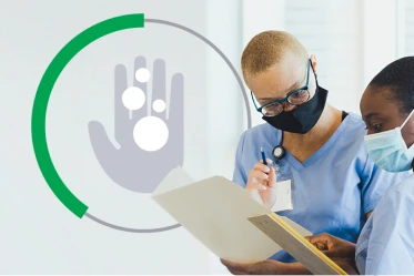 Two clinicians looking at a clipboard
