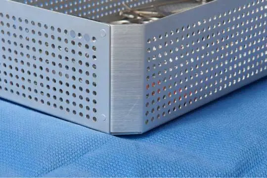 exposed metal corner of instrument tray