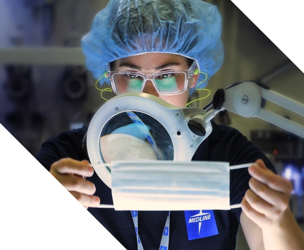 home-banner-may-2023 Quality control expert inspecting Medline facemask