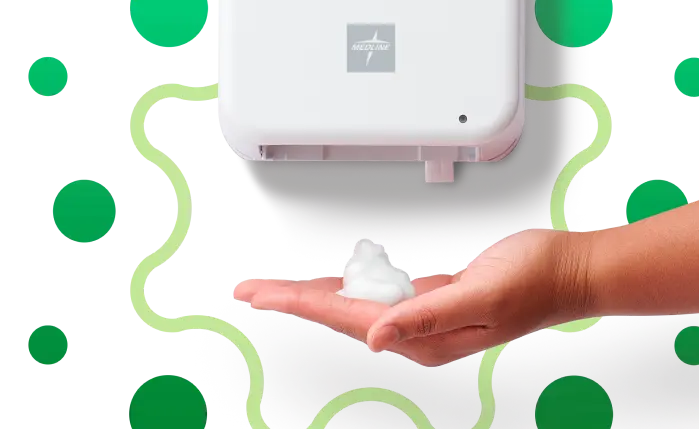 Hand with hand sanitizer under wall-hung sanitizer dispenser