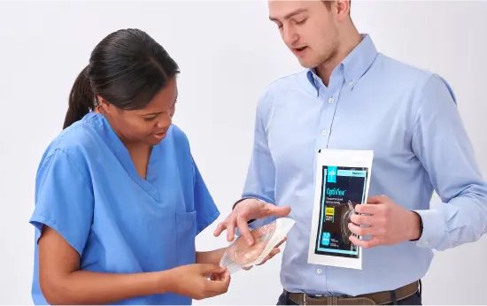 optiview-assessment Skin Health specialist shows the dressing and packaging to a clinician