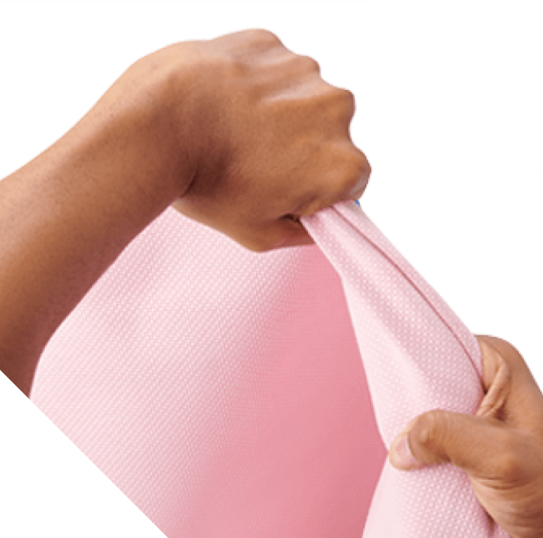 closeup of two hands pulling hard on Titan wrap to test strength