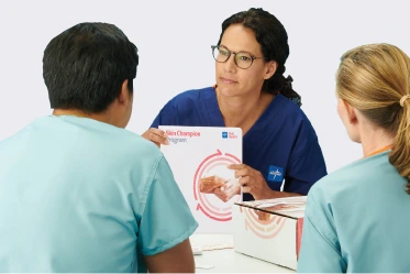 Clinician showing pressure injury prevention education