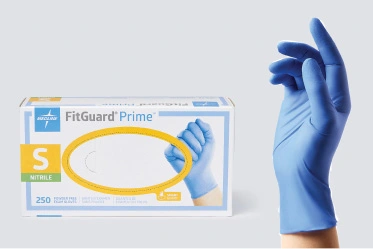 Nitrile Box of FitGuard Prime exam gloves next to hand modeling a nitrile glove
