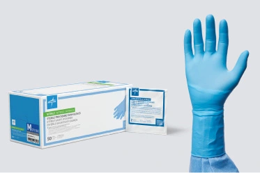 Sterile Box of gloves next to a hand modeling a sterile exam glove