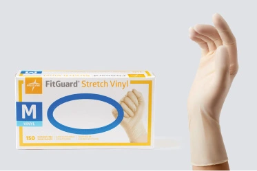 Vinyl Box of FitGuard Stretch Vinyl next to hand modeling a vinyl gloves
